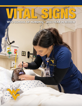 A nursing student practices on a simulation manikin.