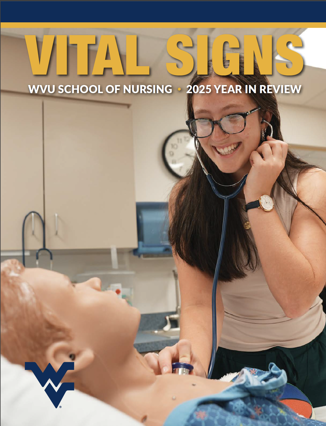 A nursing student listens to a manikin's chest with a stethoscope.